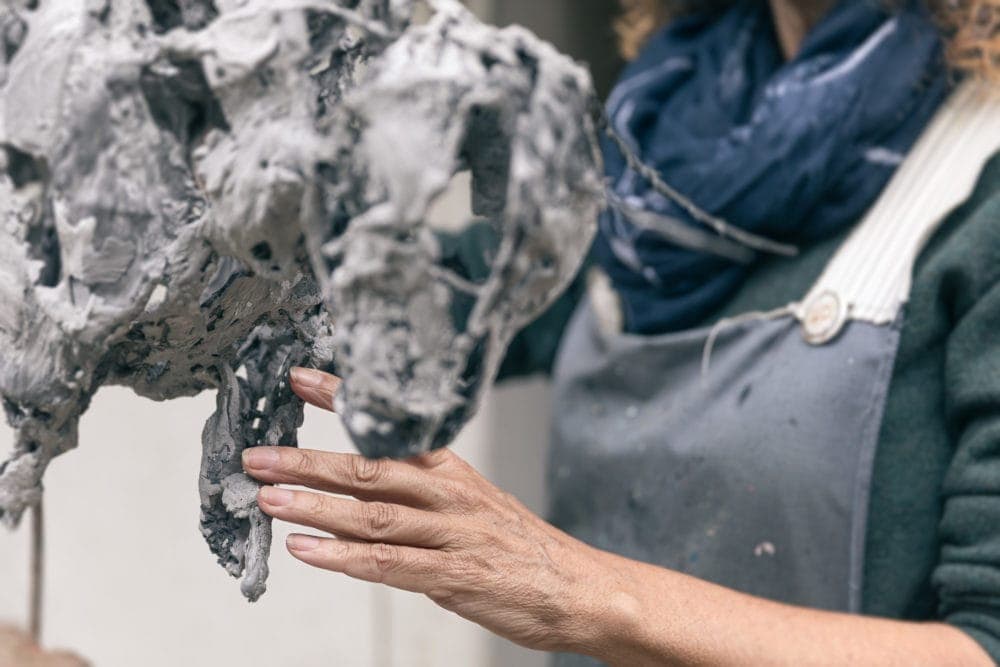 A Close Up Of Melanie Working A Bull Sculpture. Melanie Deegan Sculpter Langport